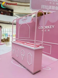 Customizable Cosmetics Retail Counter with Pink Frame and Logo Signage Mall Pop-Up Display Kiosk